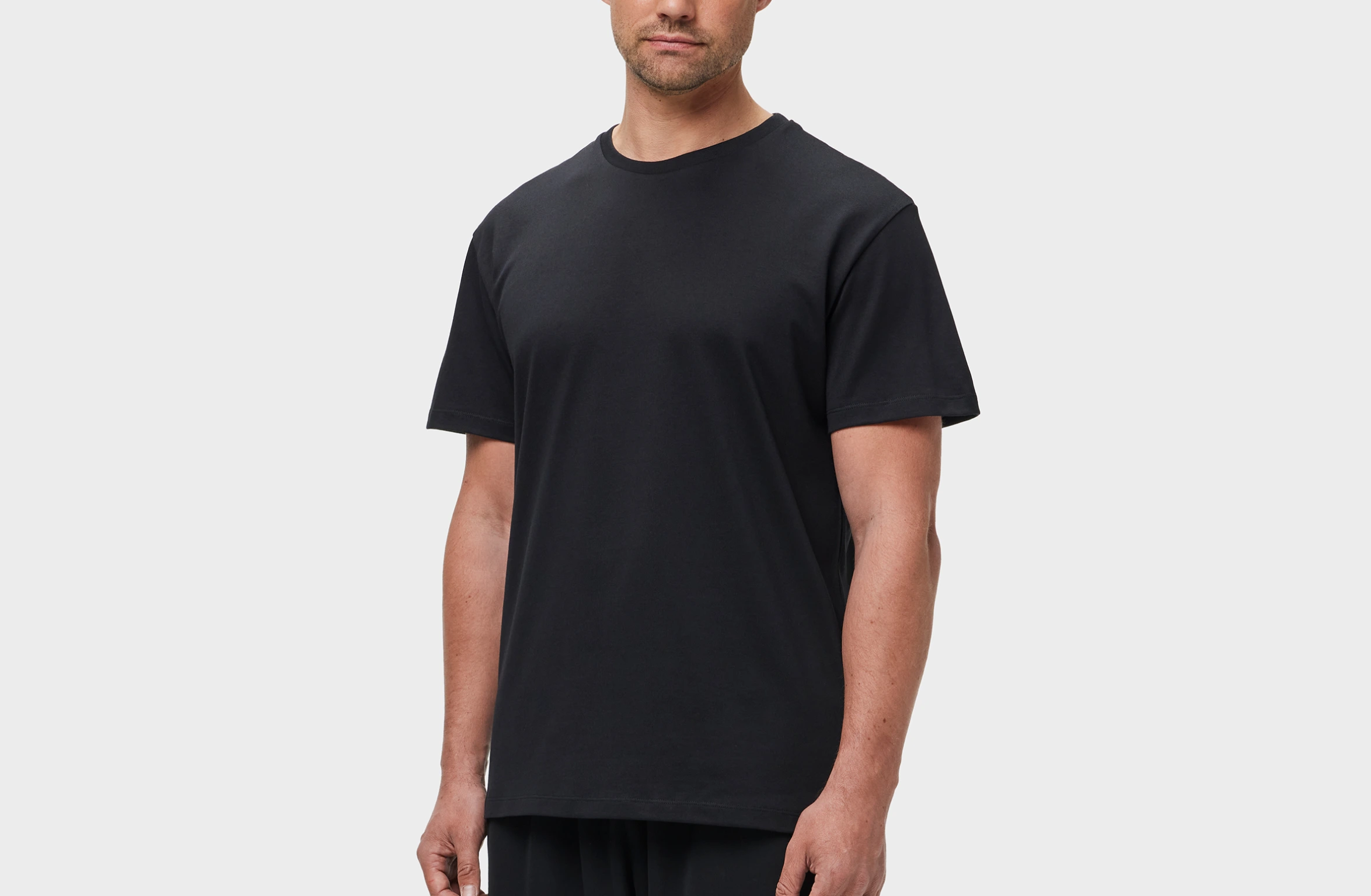 Black t-shirt with big tone-on-tone Polestar wordmark across the upper back