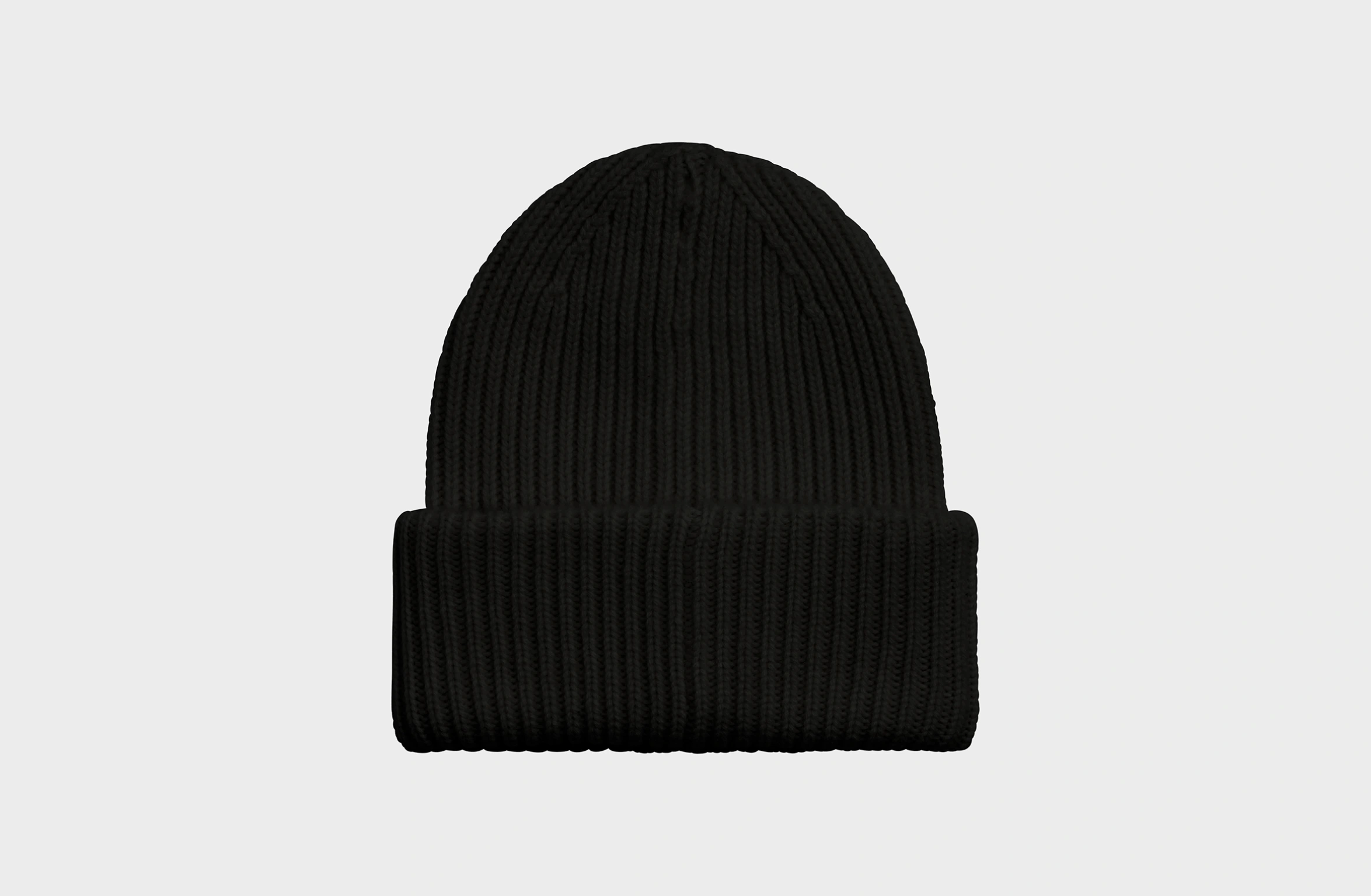 Black knitted cashmere beanie with a small orange Polestar detail