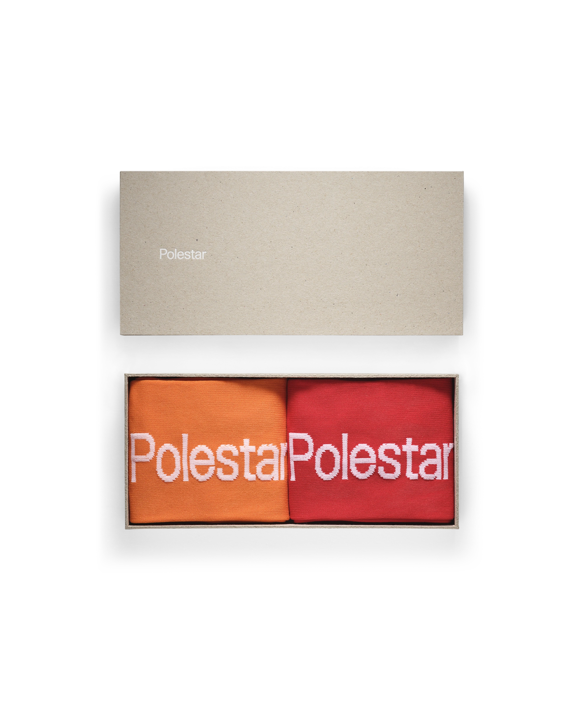 Package with Socks with Polestar Wordmark. One in orange and one in red