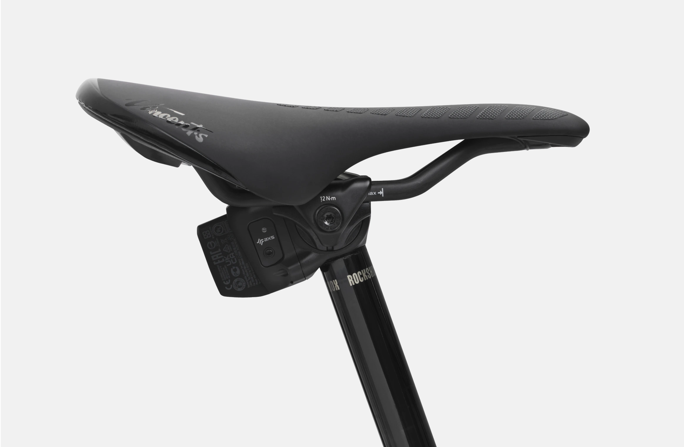 Elektrisk mountainbike med sort kulfiberstel, guldfarvet Öhlins-affjedring og Schwalbe-dæk i samarbejde med Allebike.