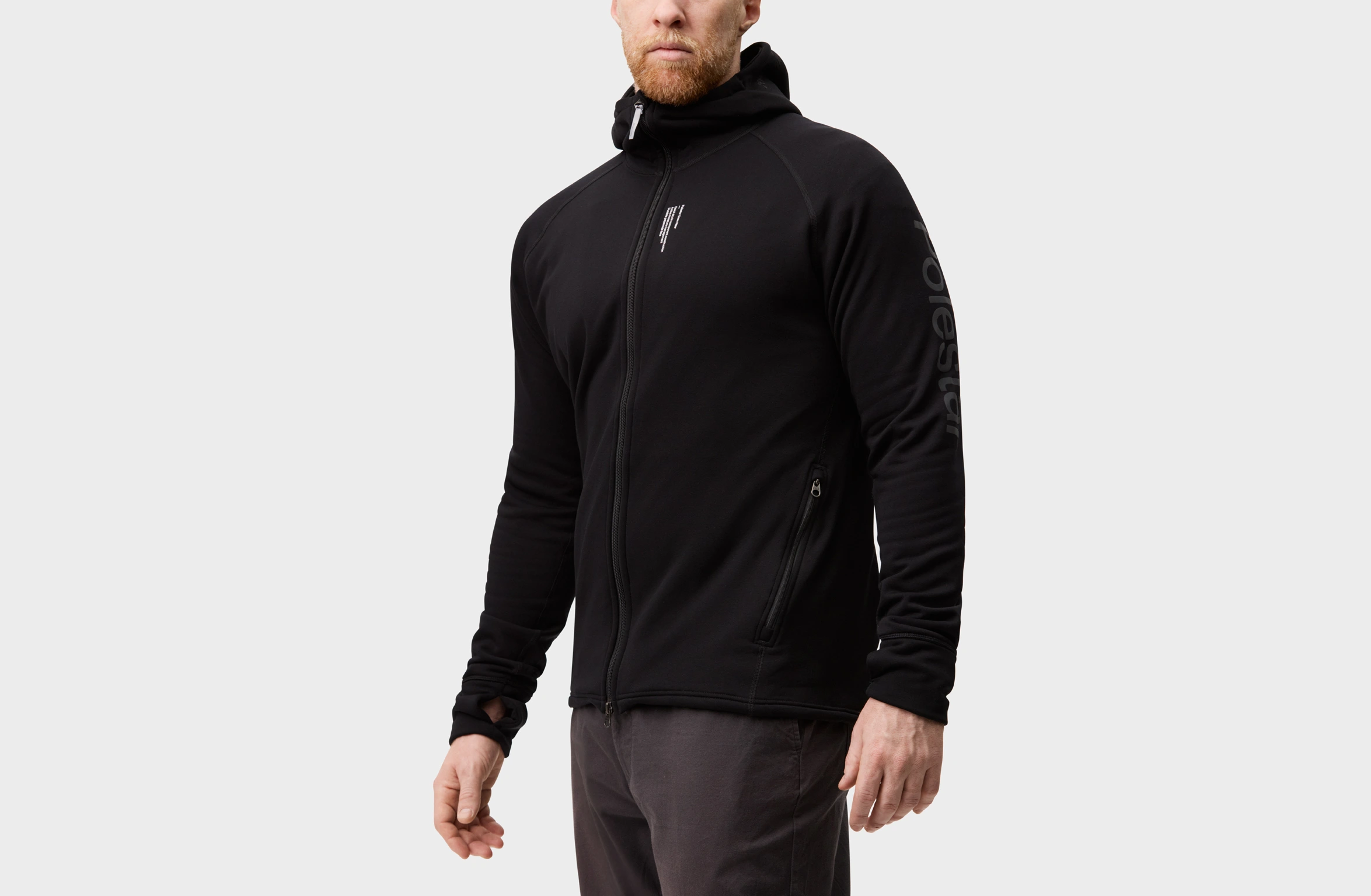 Black full-sipe hoodie with Polestar wordmark on the left sleeve and Polestar symobl on left back