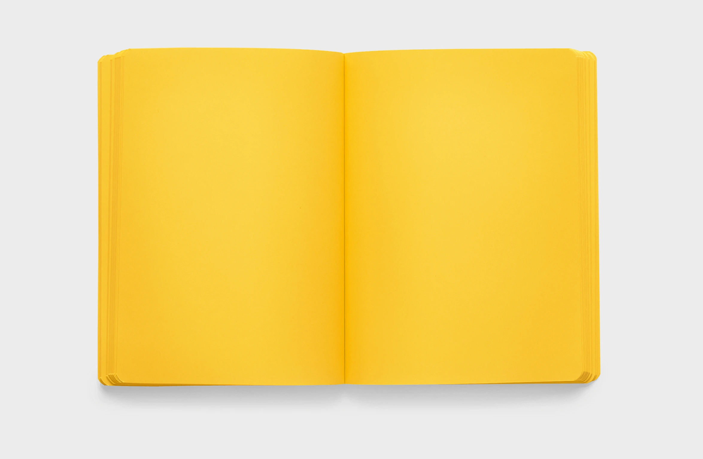 Yellow notbook in leather, elastic strap and integrated pen and phone holder, and a rounded spine.