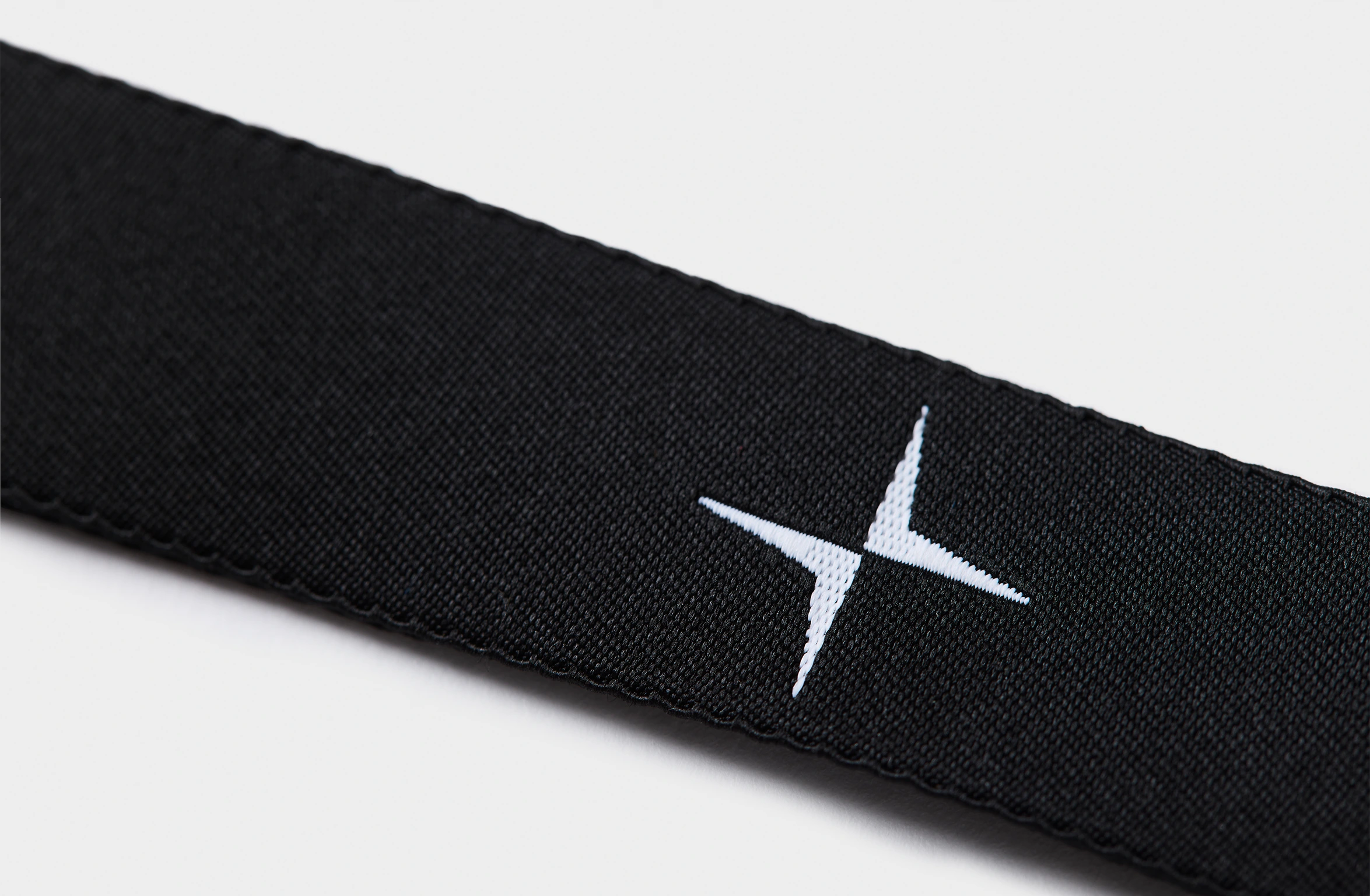 Black keychain with the text 'Polestar' in white