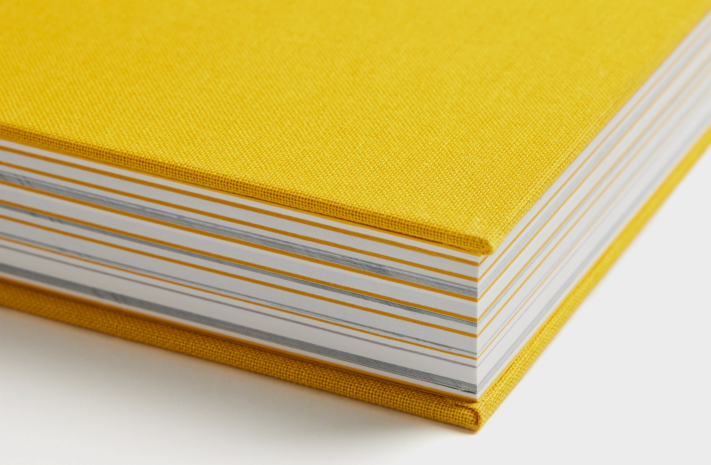 Yellow hardcover book with the embossed text "Polestar 3" on the cover.