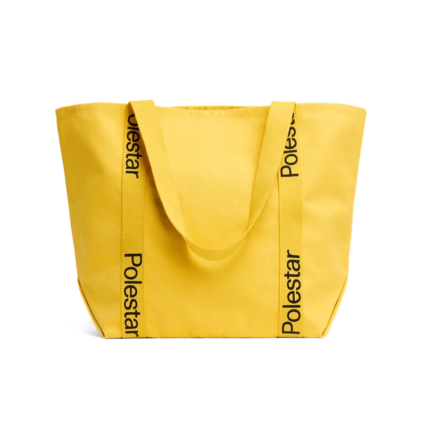 Yellow tote bag with handles adorned with a black Polestar wordmark