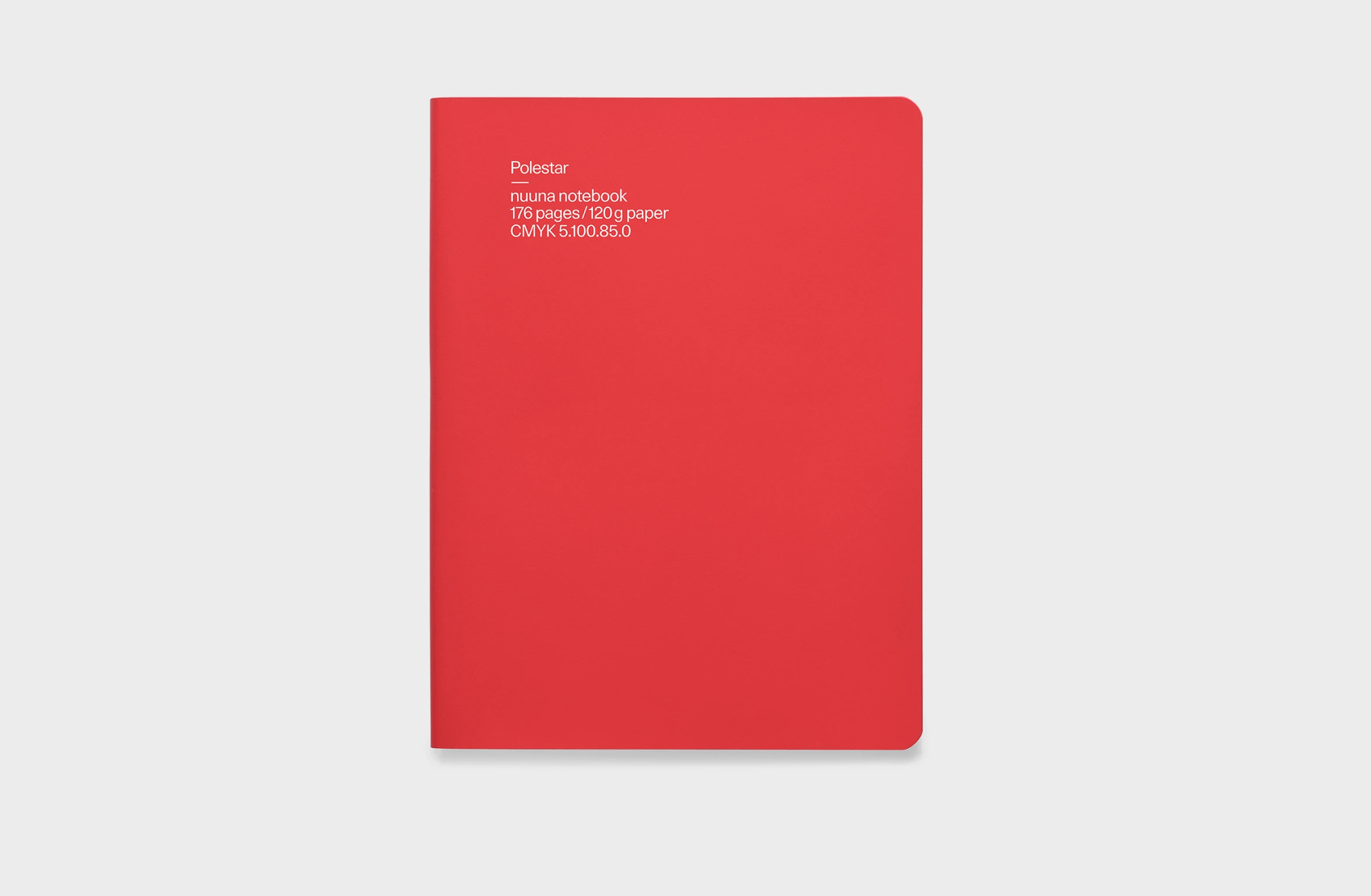 Red notbook in leather, elastic strap and integrated pen and phone holder, and a rounded spine.