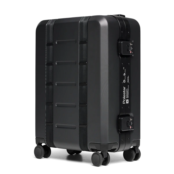Black hard-shell suitcase with reinforced edges, secure locks, and Polestar x Db branding on the side.