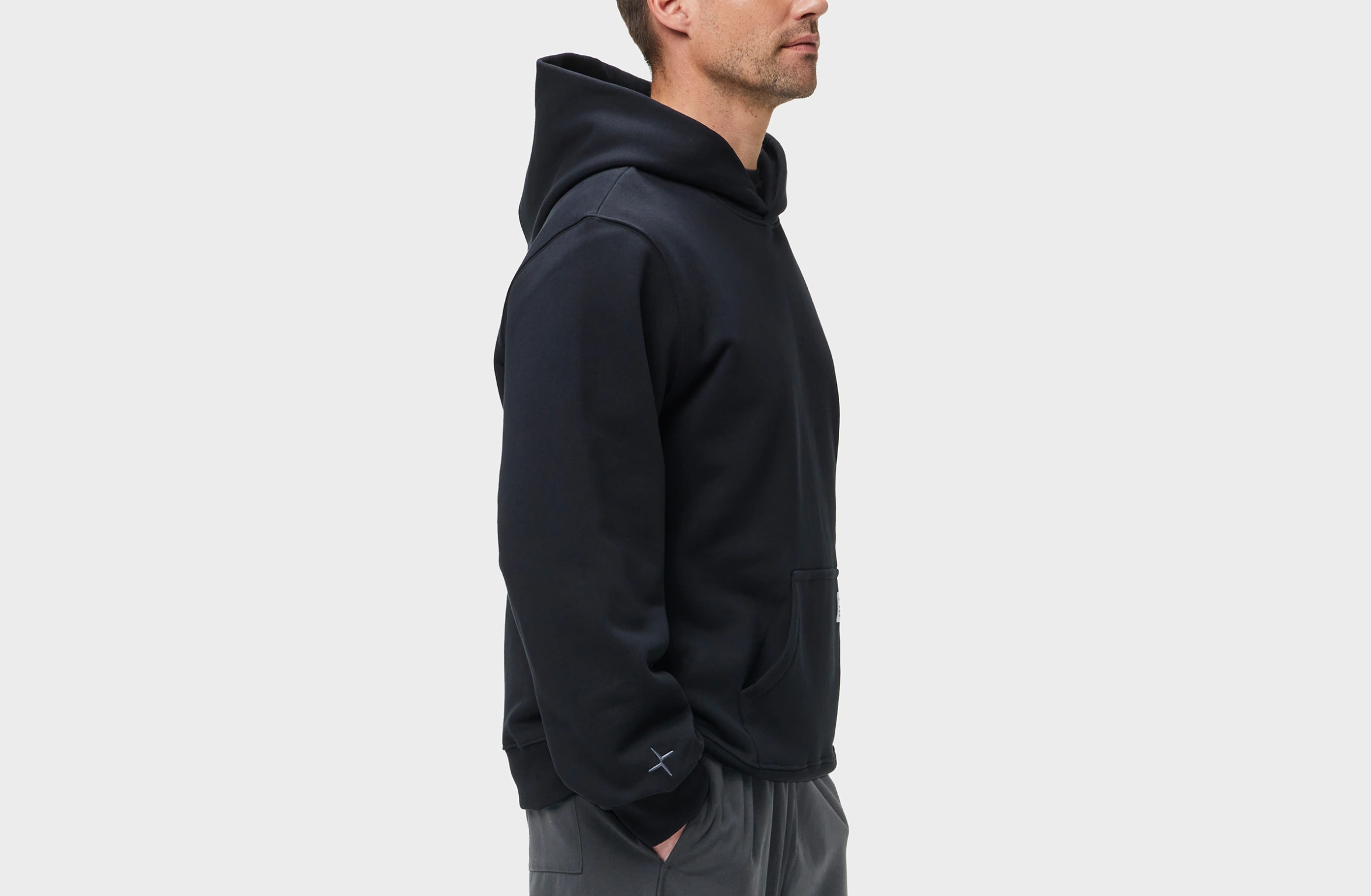 Black hoodie with big Polestar wordmark on left sleeve