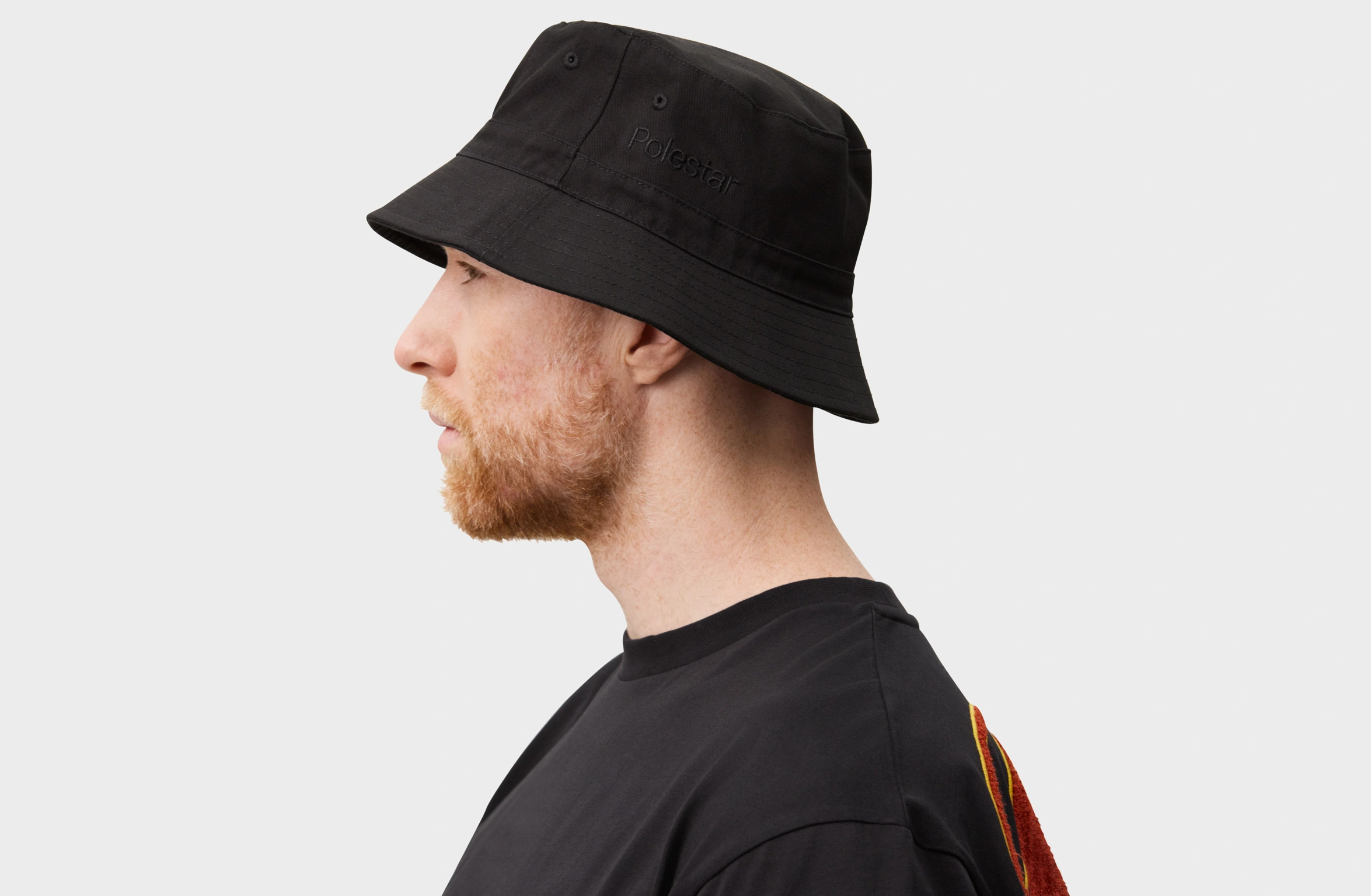 Black bucket hat with tone-on tone Polestar wordmark on the side