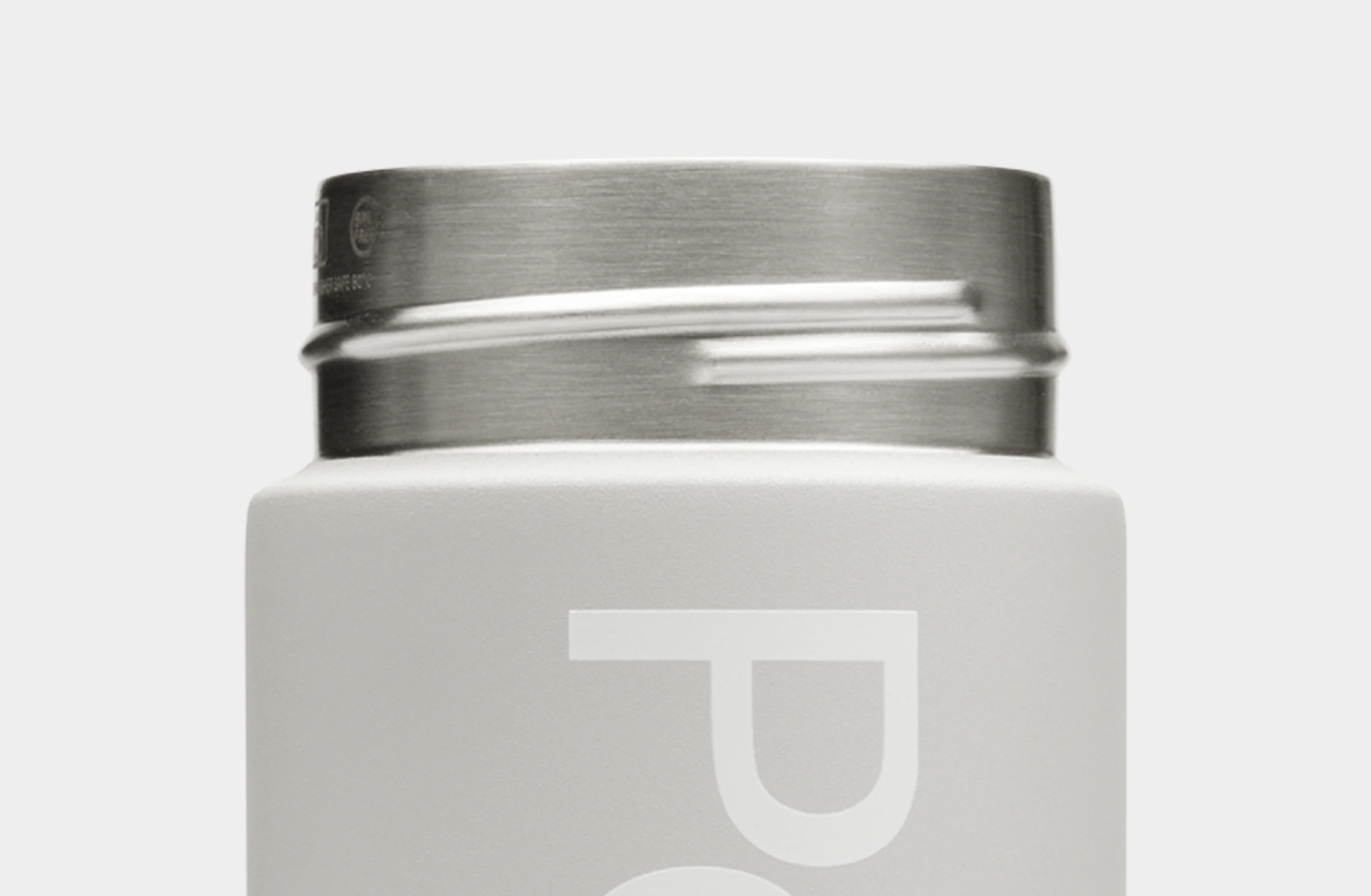 Gray water bottle with white Polestar wordmark and orange details