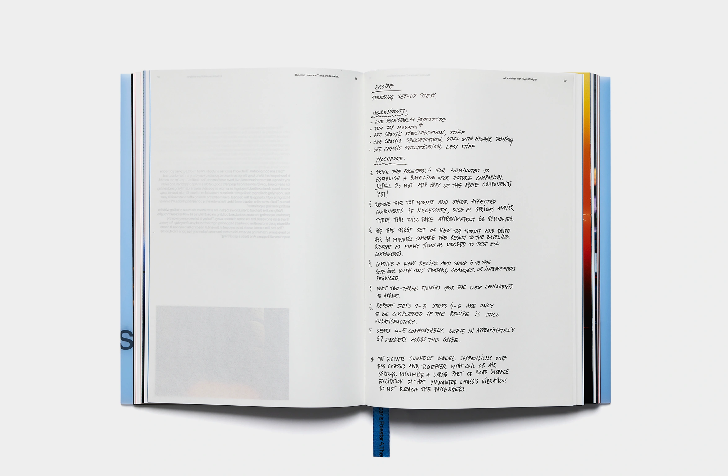 A light blue book with subtle embossed text and a blue bookmark.