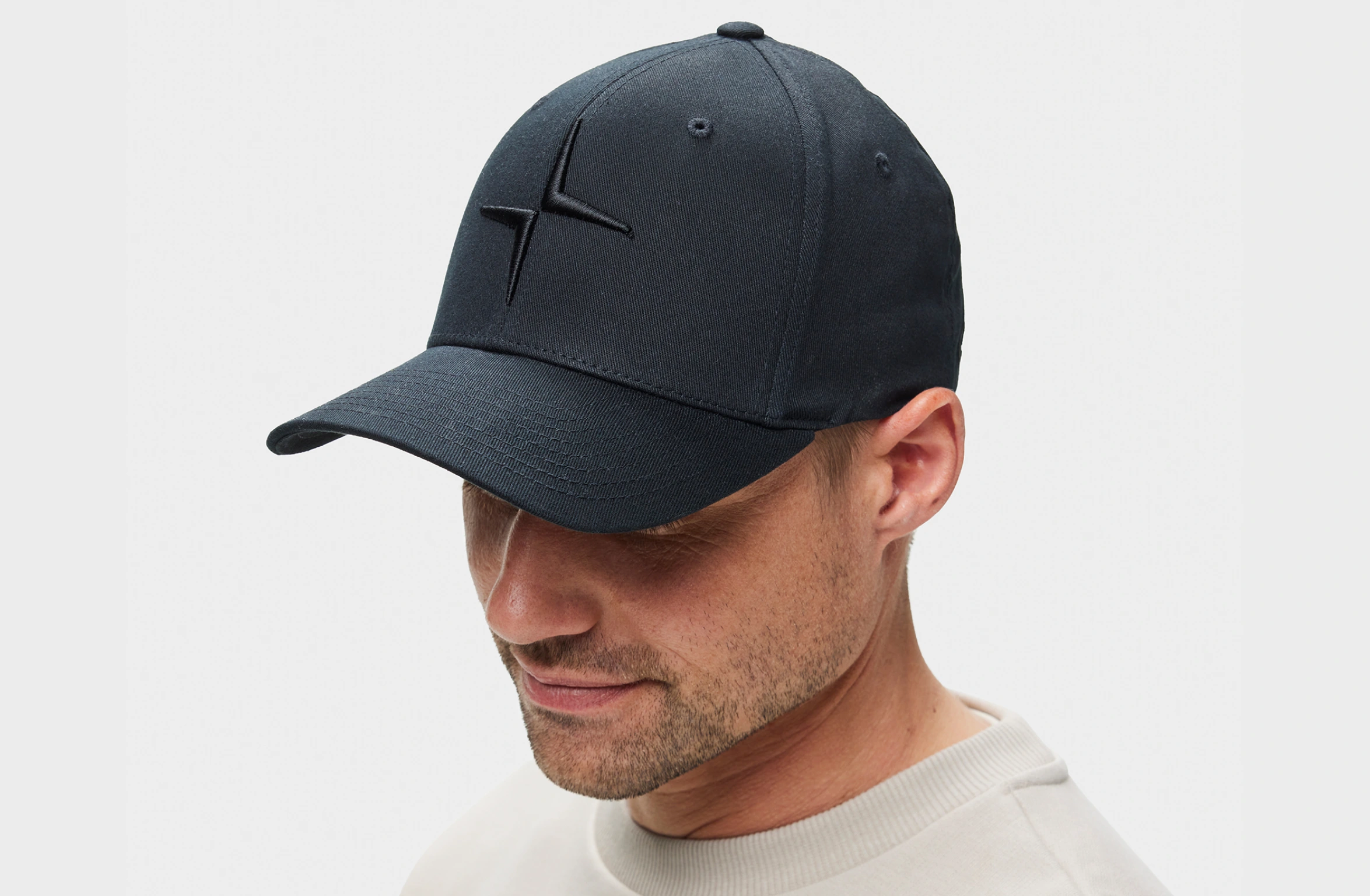 Black cap with tone-on-tone Polestar symbol on the front