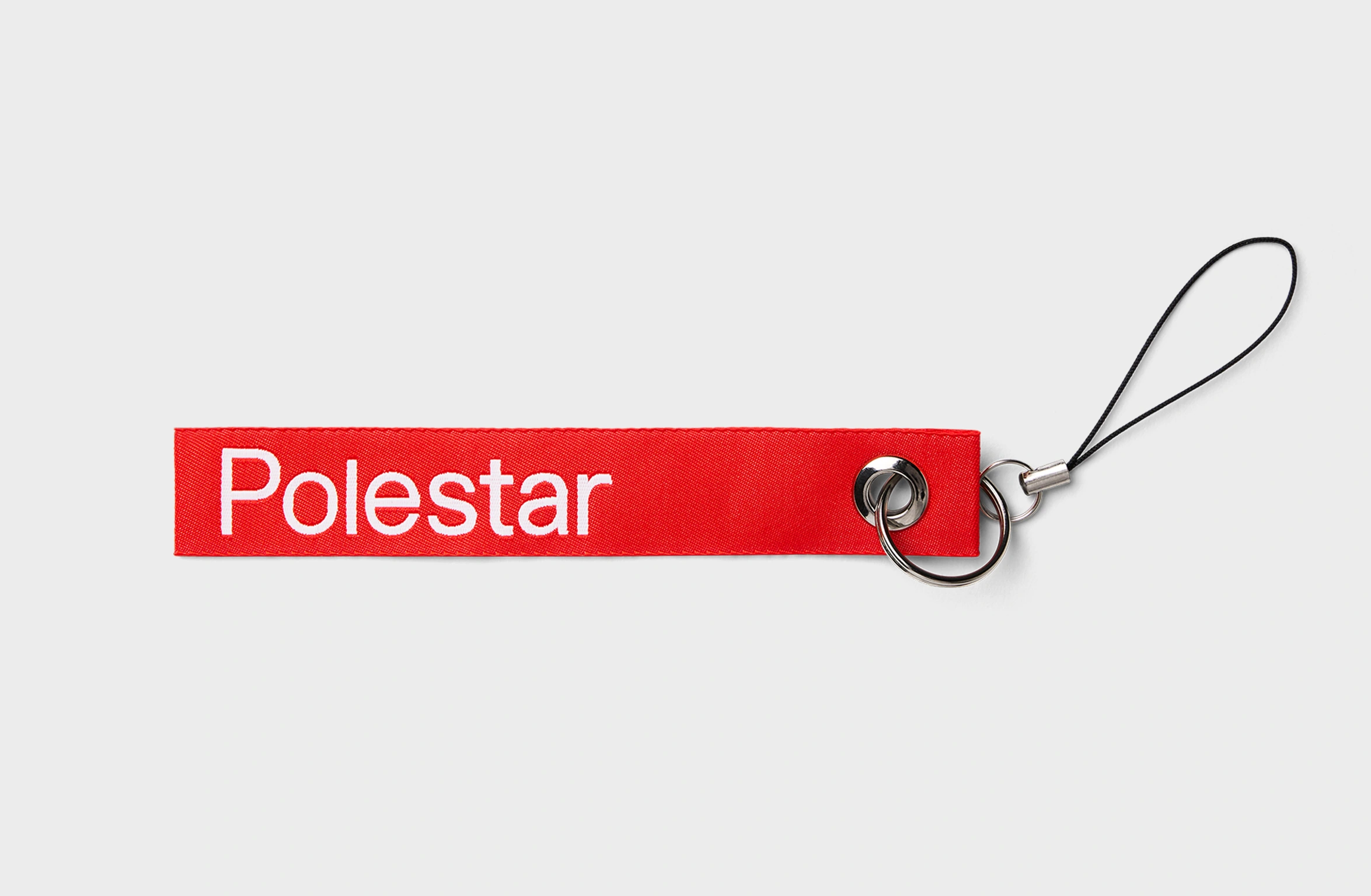 Rode sleutelhanger met witte tekst "Polestar"