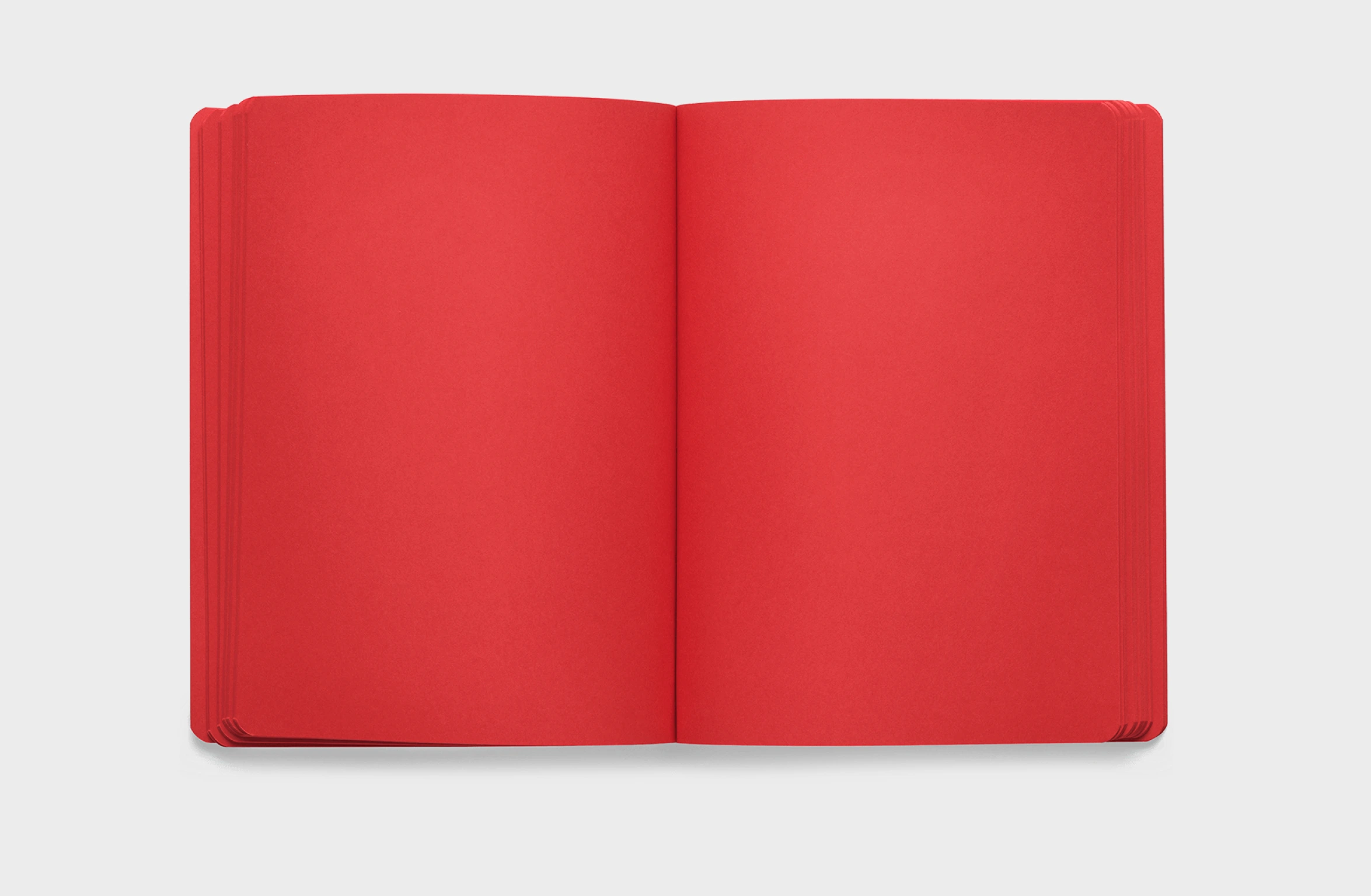 Red notbook in leather, elastic strap and integrated pen and phone holder, and a rounded spine.