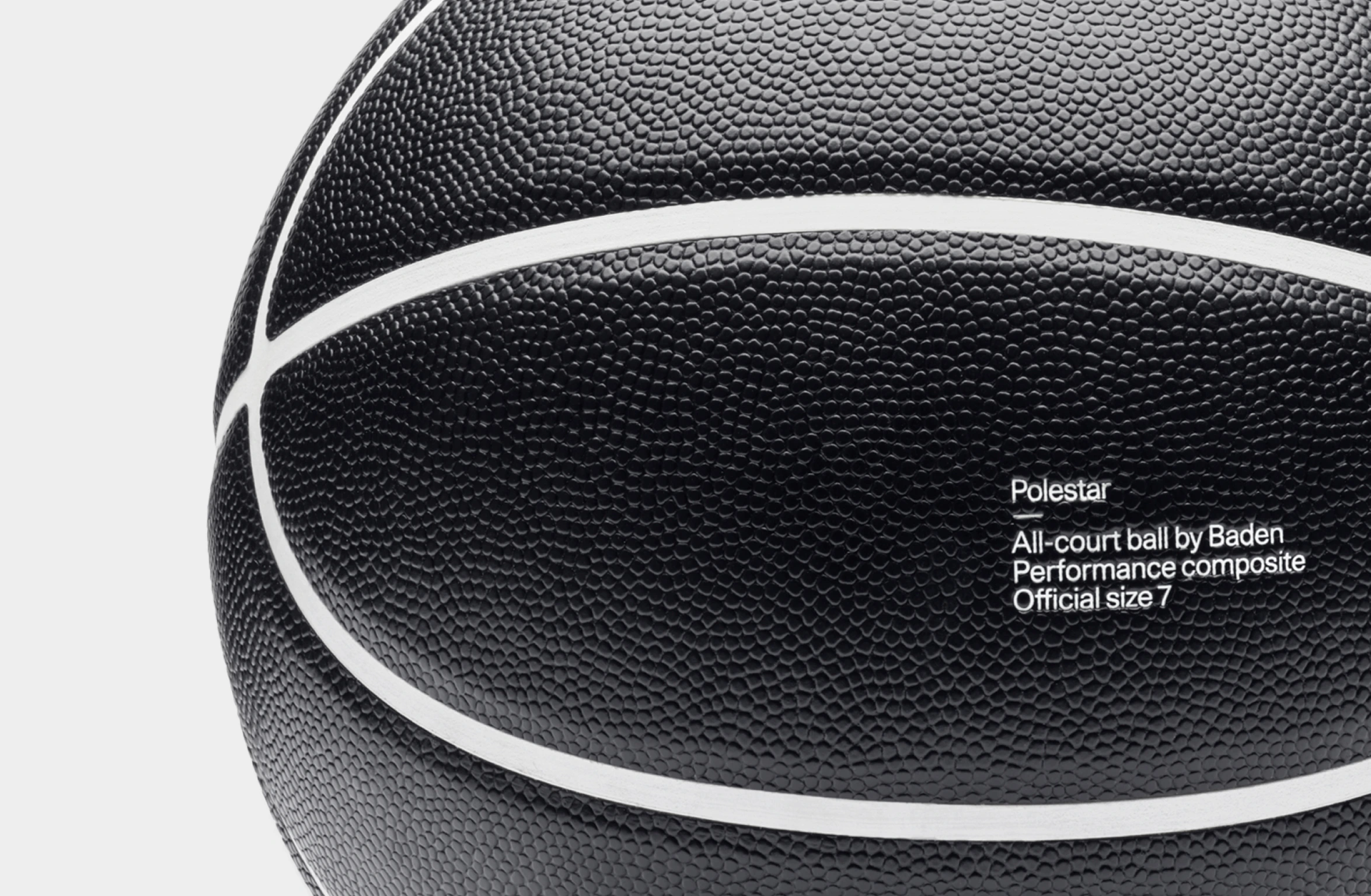 Black basketball with white lines and Polestar wordmark