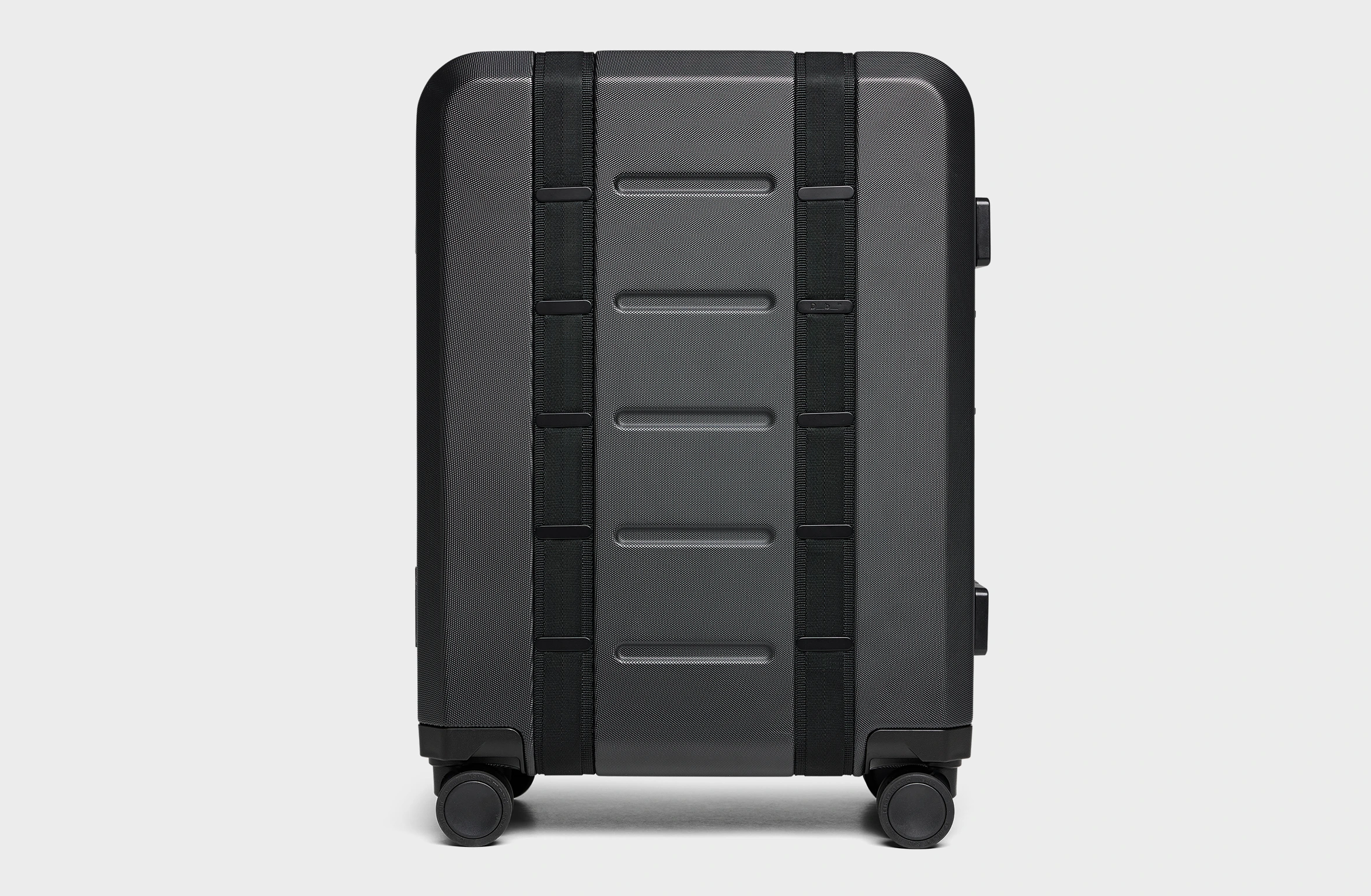 Black hard-shell suitcase with reinforced edges, secure locks, and Polestar x Db branding on the side.