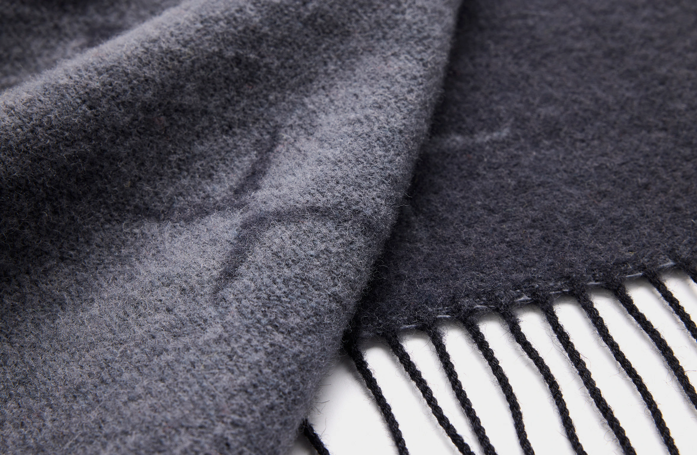 Black scarf with a repeating minimalist cross pattern of the Polestar symbol