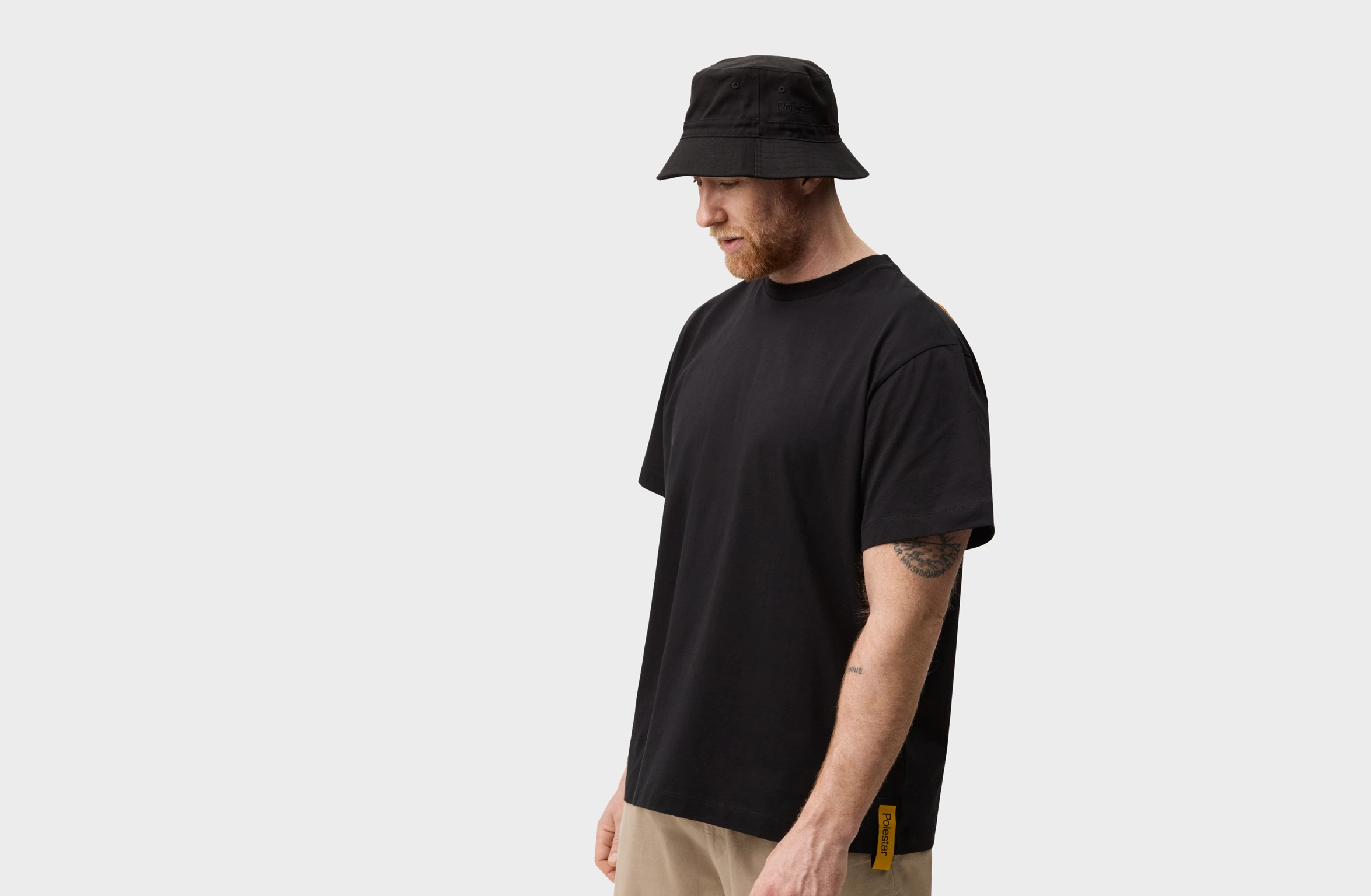 Black bucket hat with tone-on tone Polestar wordmark on the side