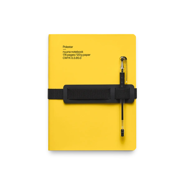 Yellow notbook in leather, elastic strap and integrated pen and phone holder, and a rounded spine.