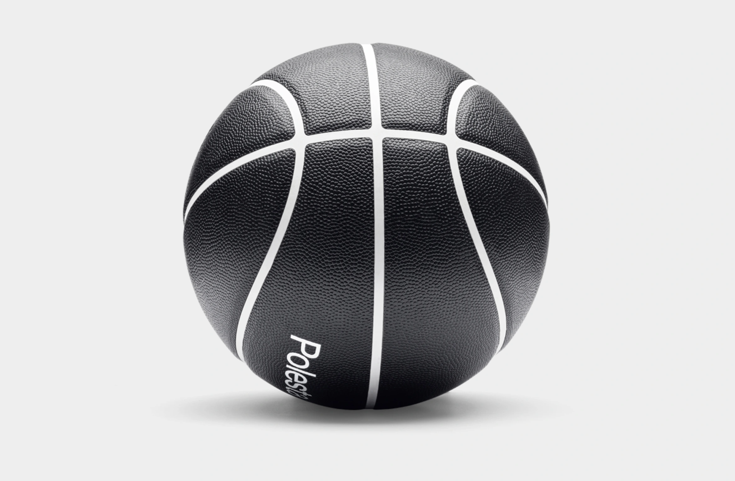 Black basketball with white lines and Polestar wordmark